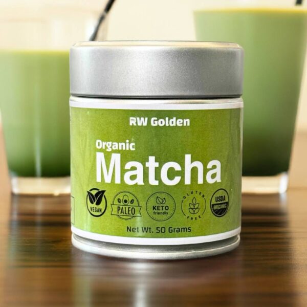 RW Golden Organic Matcha Tin with two matcha lattes in the background